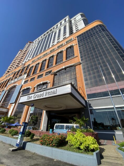 A tall building with a sign

AI-generated content may be incorrect.